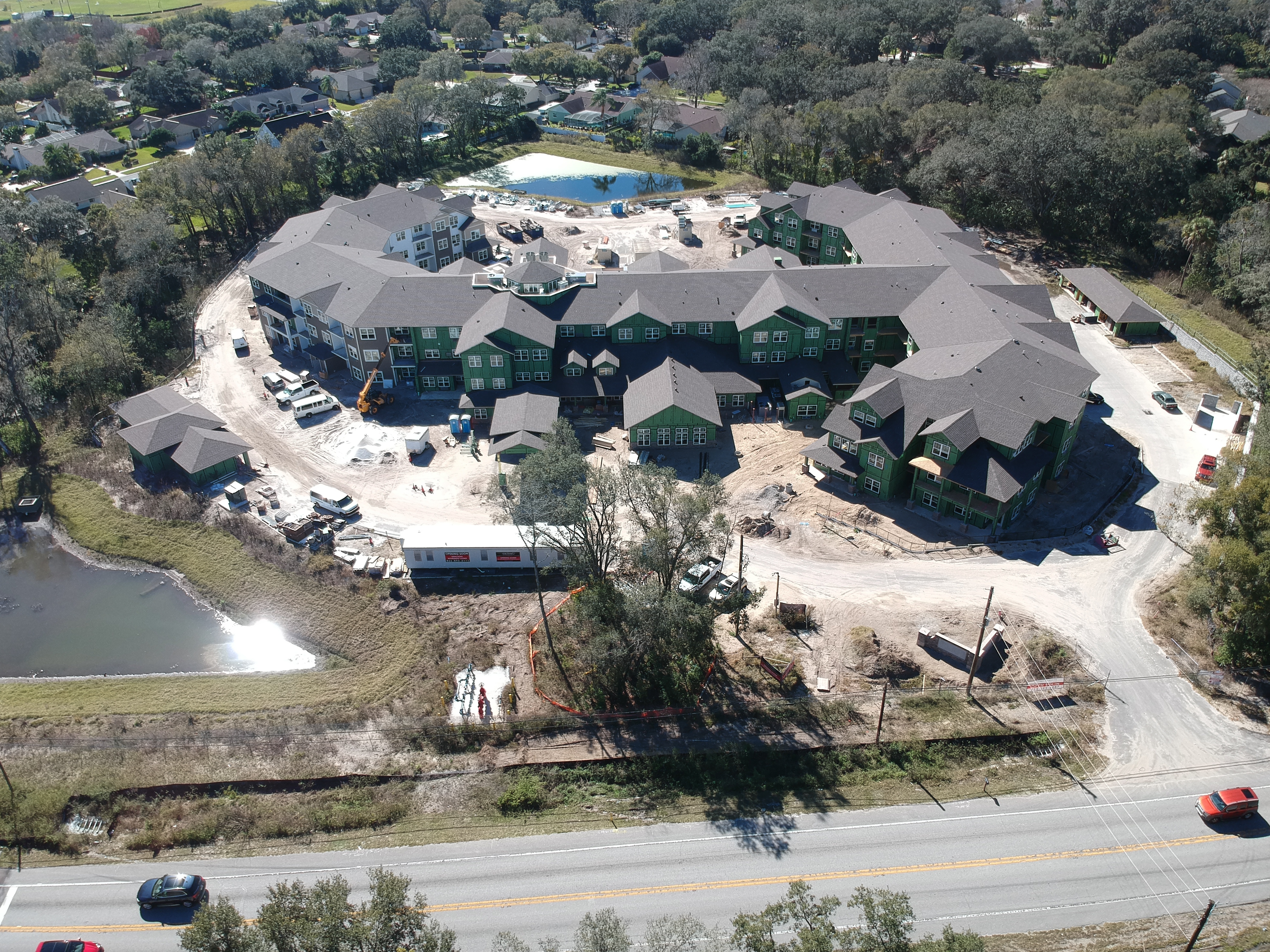 Large scale multifamily apartment complex aerial view ground up construction
